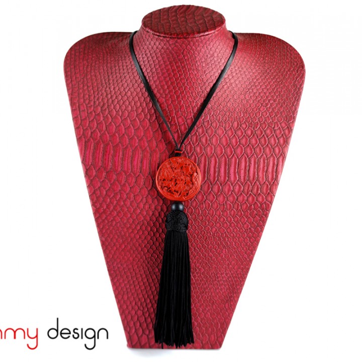 Necklace designed with red round pendant and black tassel